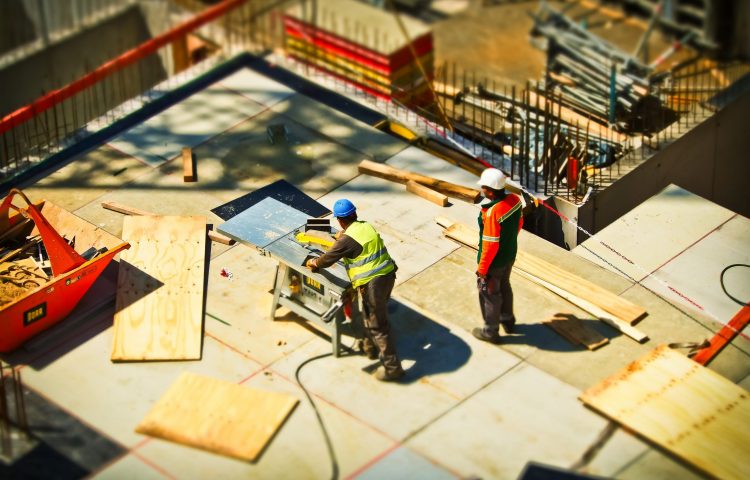 2-man-on-construction-site-during-daytime
